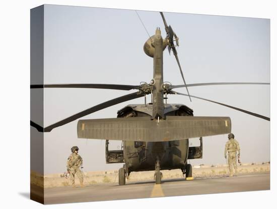 Crew Chiefs Stand Beside their UH-60L Black Hawk Helicopter-null-Premier Image Canvas