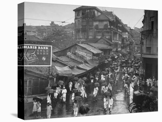 Crowds under Umbrellas on Street Outside Bombay Cotton Exchange During Monsoon Season-Margaret Bourke-White-Premier Image Canvas