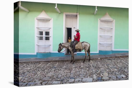 Cuba, Trinidad, Milkman on Horseback Delivers Bottles of Milk to House-Jane Sweeney-Premier Image Canvas