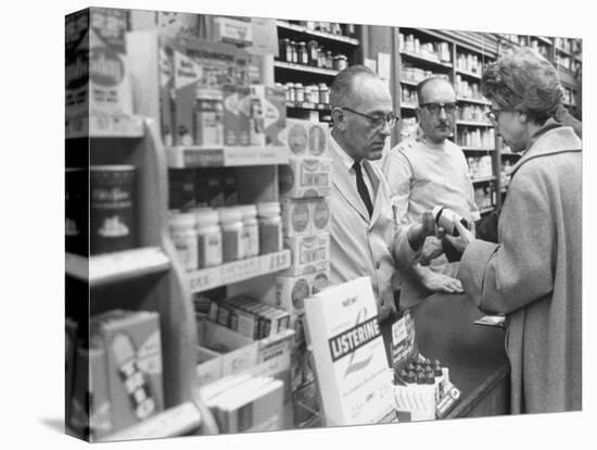 Customer Buying Tranquilizers at Drug Store-Ralph Morse-Premier Image Canvas