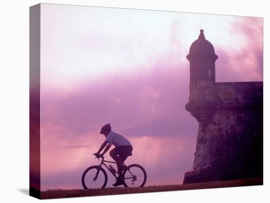 Cycling at El Morro in Old San Juan at Sunset, Puerto Rico-Greg Johnston-Premier Image Canvas