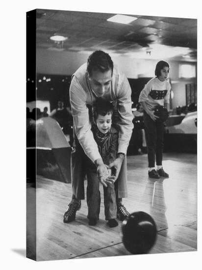 Dad Showing 3 Year Old Daughter the Basics of Bowling-George Silk-Premier Image Canvas