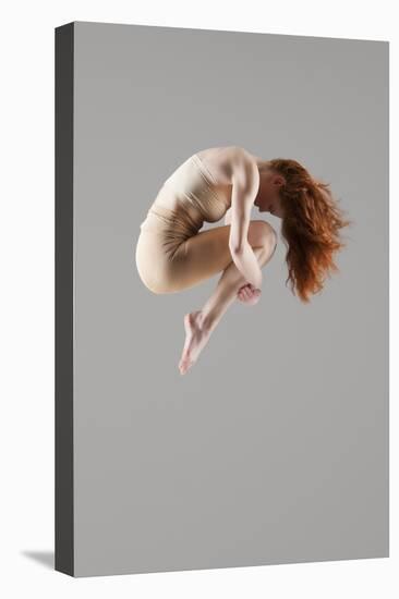 Dancer in Mid-Air with Arms around Knees-null-Stretched Canvas