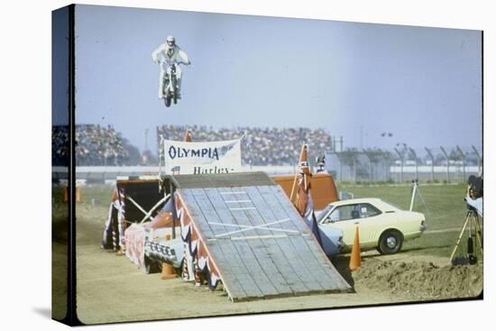 Daredevil Motorcyclist Evel Knievel Rising Very High Off Platform During Performance of a Stunt-Bill Eppridge-Premier Image Canvas