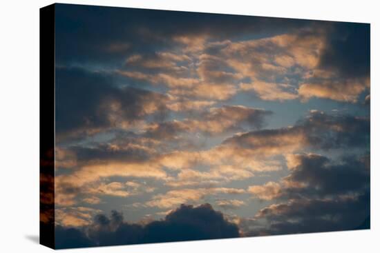 Dark Clouds over a Hilly Landscape at Sunset-Clive Nolan-Premier Image Canvas