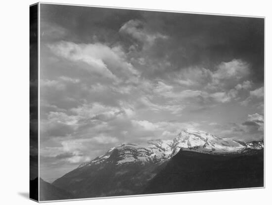 Dark Foreground And Clouds Mountains Highlighted "Heaven's Peak" Glacier NP Montana. 1933-1942-Ansel Adams-Stretched Canvas