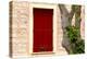 Dark red shutters in the wall of a house in France.-Tom Haseltine-Premier Image Canvas