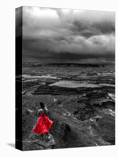 Dark storm clouds over Dead Horse Point State Park with girl in red dress standing near the cliff-David Chang-Premier Image Canvas
