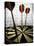 Darts on a Dartboard with Stock Figures in the Background-null-Premier Image Canvas