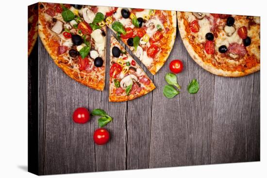 Delicious Italian Pizzas Served on Wooden Table-Jag_cz-Premier Image Canvas