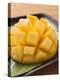 Diced Mango Still Attached to the Skin on Brown Plate-null-Premier Image Canvas