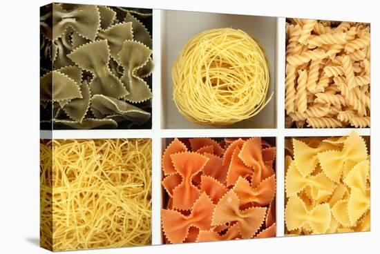 Different Types Of Pasta In White Wooden Box Sections Close-Up-Yastremska-Stretched Canvas