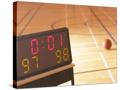 'Digital Scoreboard Noting the Score and Time Left on Clock During