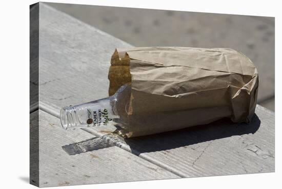 Discarded Rum Bottle In Paper Bag-Mark Williamson-Premier Image Canvas
