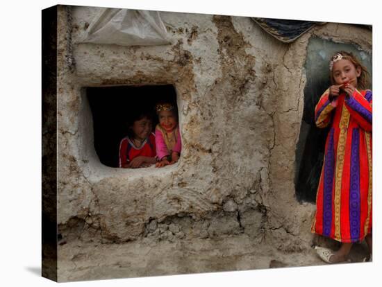 Displaced Girls Smile as They Look Out from a Shanty, in a Refugee Camp in Kabul, Afghanistan-null-Premier Image Canvas