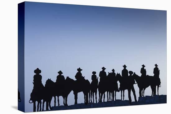 Dodge City Sign with Cowboy Silhouettes, Kansas, USA-Walter Bibikow-Premier Image Canvas