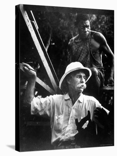 Dr. Albert Schweitzer, Medical Missionary and Humanitarian, with Carpenter at Site of His Hospital-W^ Eugene Smith-Premier Image Canvas