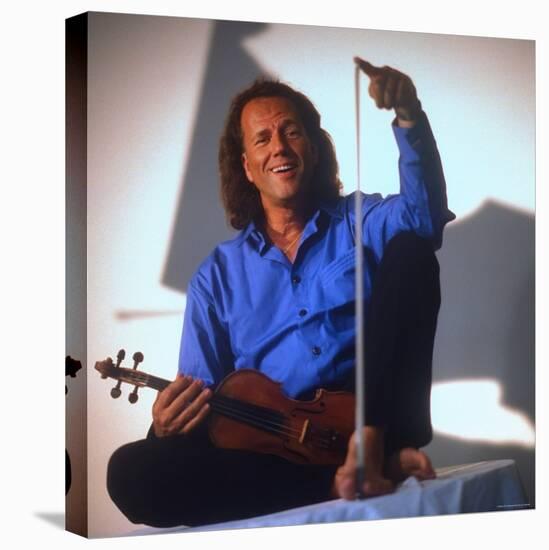 Dutch Violinist Andre Rieu Relaxing, Taking Practice Break with Violin-Ted Thai-Premier Image Canvas