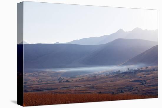 Early morning mist, Tsaranoro Valley, Ambalavao, central area, Madagascar, Africa-Christian Kober-Premier Image Canvas