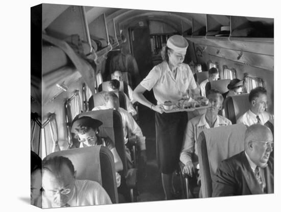 Eastern Airline Travelers Receiving a Mid-Flight Meal from a Female Steward-null-Premier Image Canvas