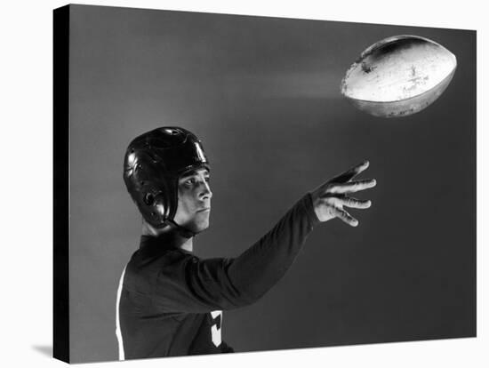 Eddie Miller of NY Giants Demonstrates Spiral Pass by Gripping Ball Along Lacing Close to the Ear-Gjon Mili-Premier Image Canvas
