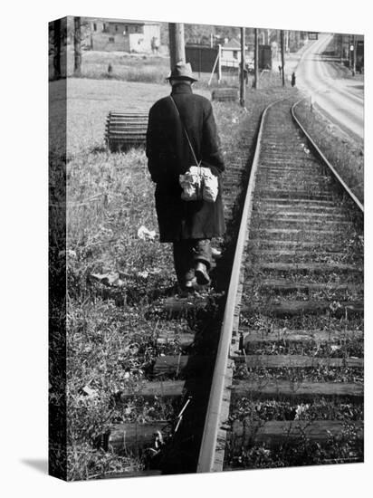 Elderly Hobo, with Bundle Strapped to His Back, Walking Along Train Tracks-Carl Mydans-Premier Image Canvas