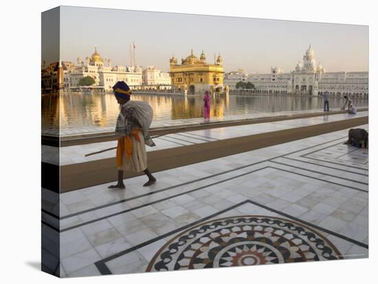 Elderly Sikh Pilgrim with Bundle and Stick Walking Around Holy Pool, Amritsar, India-Eitan Simanor-Premier Image Canvas