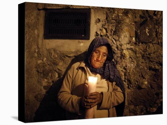 Elderly Woman Holds a Candle as She Takes Part in a Procession During Holy Week in Taxco, Mexico-null-Premier Image Canvas