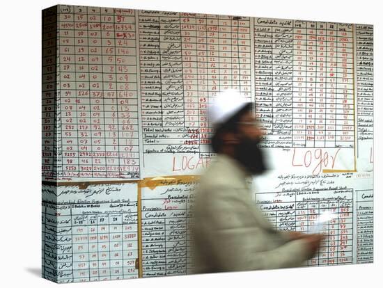 Electoral Worker Passes Election Results Posted on Wall at a Counting Center in Kabul, Afghanistan-null-Premier Image Canvas