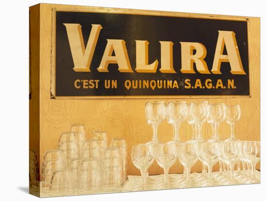 Empty Wine & Water Glasses in Front of Valira Publicity Sign-Peter Medilek-Premier Image Canvas