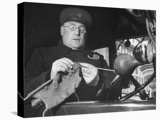 English Cabby Dutifully Knitting Sweater For British Soldier as He Waits at Taxi Rack on Oxford St-Carl Mydans-Premier Image Canvas
