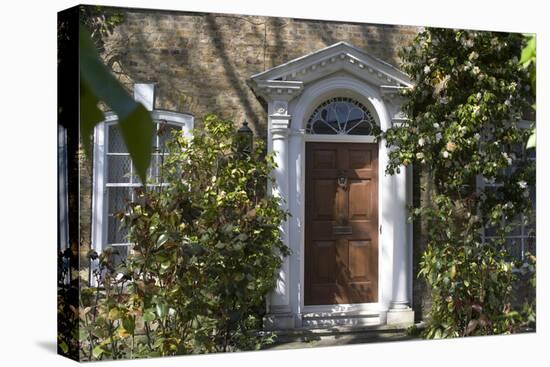 Entrance into a House with Grand Door with Window Lights, Surrounded by Vegetation-Natalie Tepper-Stretched Canvas