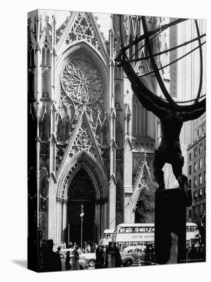 Entrance to St. Patrick's Visible Across Fifth Avenue, with Atlas Statue Silhouetted in Foreground-Andreas Feininger-Premier Image Canvas