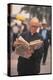 Episcopalian Priest Reading a Newspaper While Walking in Street, New York City-Vernon Merritt III-Premier Image Canvas