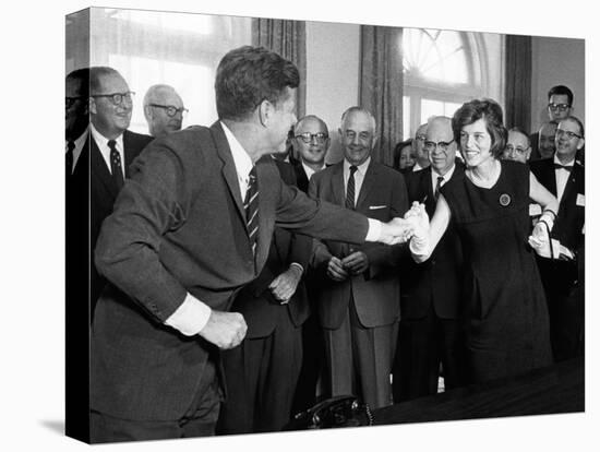 Eunice Shriver Receives a Signing Pen from Her Brother, President John Kennedy-null-Stretched Canvas