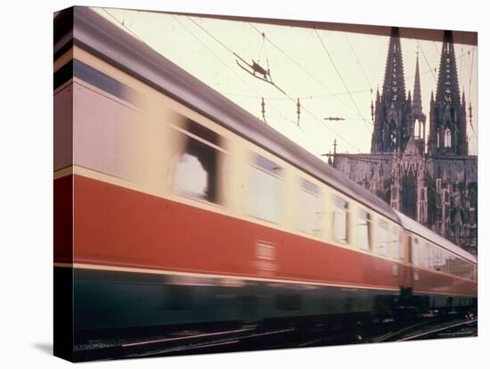 Eurailpass in Europe: Germany's Parsifal Express Speeding Past Cologne Cathedral-Carlo Bavagnoli-Premier Image Canvas