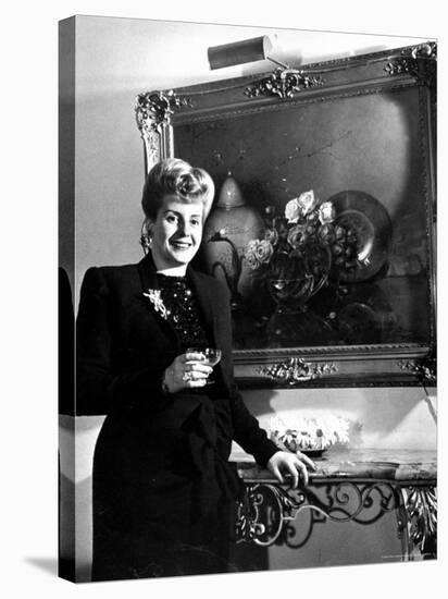 Evita Peron, Wife of Argentinean Presidential Candidate With. a Glass of Champagne in Her Apartment-Thomas D^ Mcavoy-Premier Image Canvas