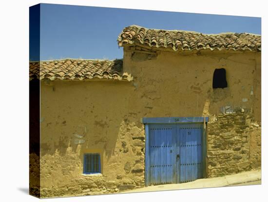 Exterior of an Adobe House with a Tile Roof and Blue Door, Salamanca, Castile Leon, Spain-Michael Busselle-Premier Image Canvas