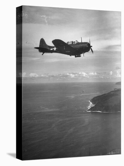 F-6 Hellcat Fighter Plane over Tanahmera Bay as Japanese Airfields at Hollandia, New Guinea-J^ R^ Eyerman-Premier Image Canvas