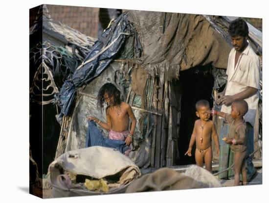 Family at Front Door of Their Rag Shanty Home, Kolkata (Calcutta), West Bengal, India-Tony Waltham-Premier Image Canvas