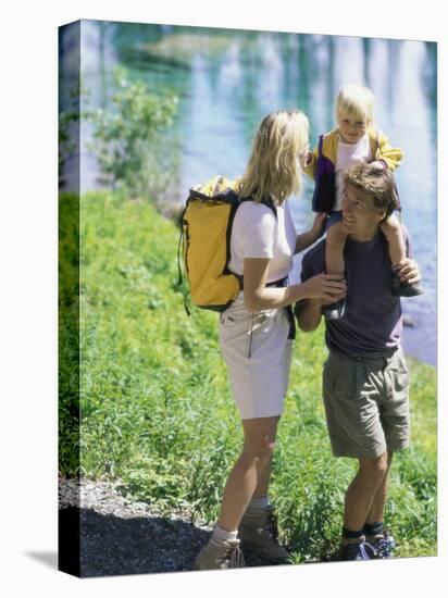 Family Hiking by a Pond-null-Premier Image Canvas