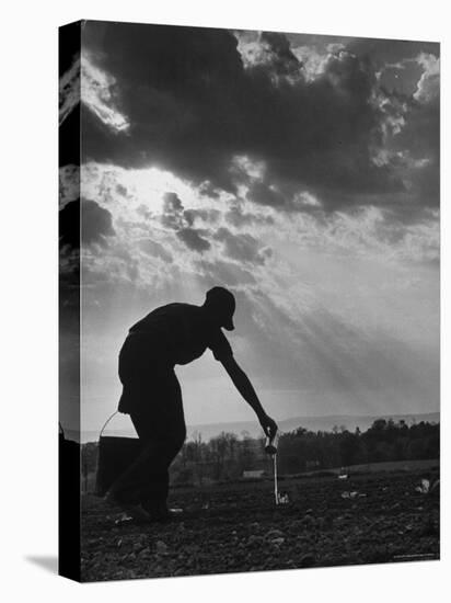 Farmer Watering the Crops-Ed Clark-Premier Image Canvas