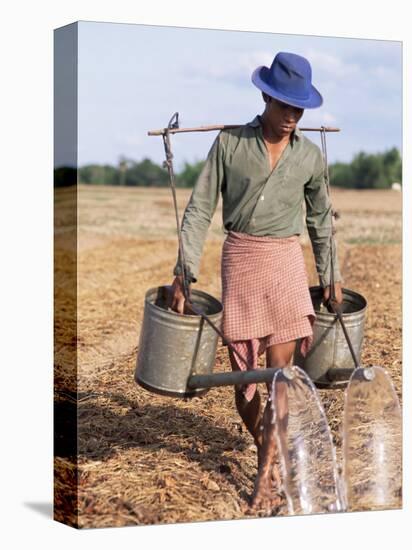 Farmer with Watering Cans, Cambodia, Indochina, Southeast Asia-Tim Hall-Premier Image Canvas