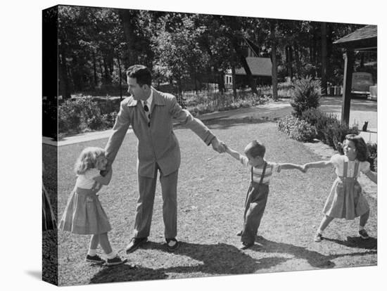 Father Playing in Yard with His Children-Wallace Kirkland-Premier Image Canvas