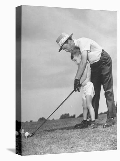 Father Teaching His Small Son How to Play Golf-null-Premier Image Canvas