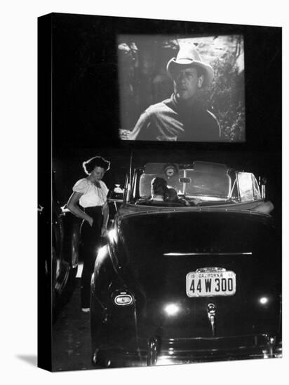 Female Car-Hop Taking Order from Couple in Convertible Car During Movie at Rancho Drive in Theater-Allan Grant-Premier Image Canvas