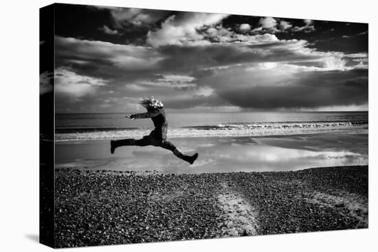Female Figure Jumping on a Beach-Rory Garforth-Premier Image Canvas