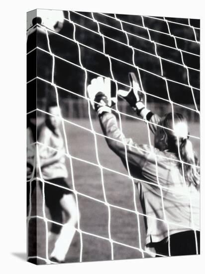 Female Goalie Attempting to Stop a Soccer Ball-null-Premier Image Canvas