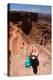 Female Hiker Smiles At The Meander Overlook Along W Rim Trail Of Deadhorse SP Near Moab, Utah-Ben Herndon-Premier Image Canvas