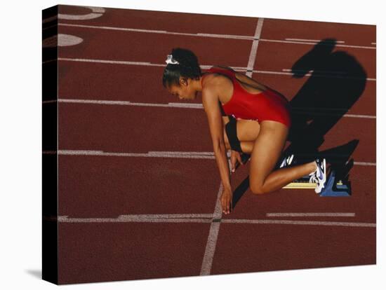 Female Runner at the Start of a Track Race-null-Premier Image Canvas